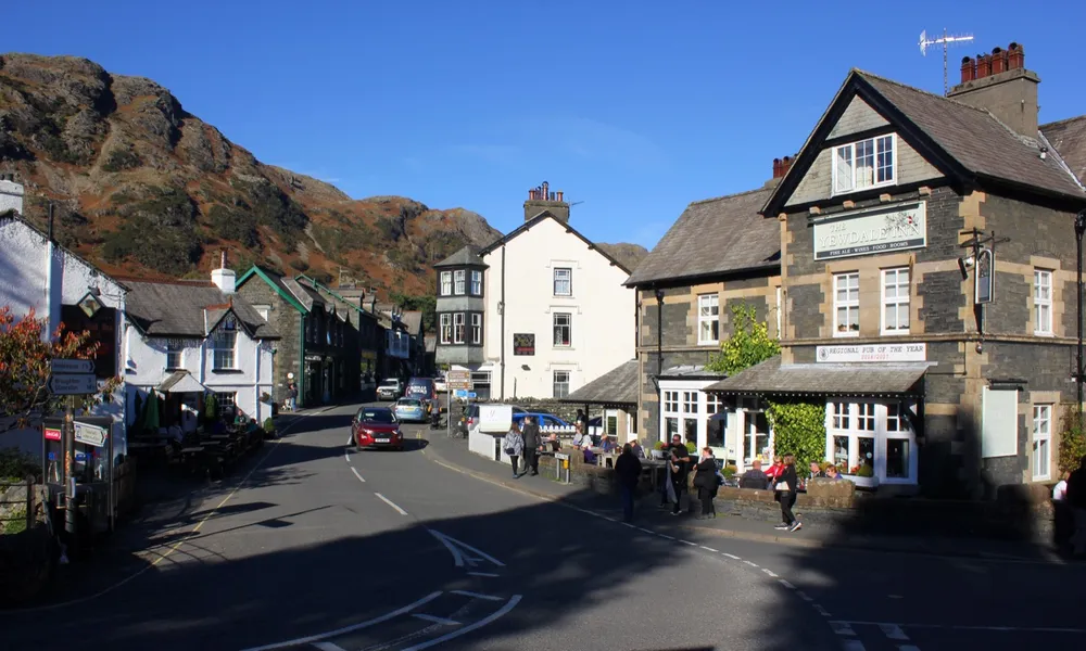 Coniston village, with the fells behind and the Yewdale Inn on the right