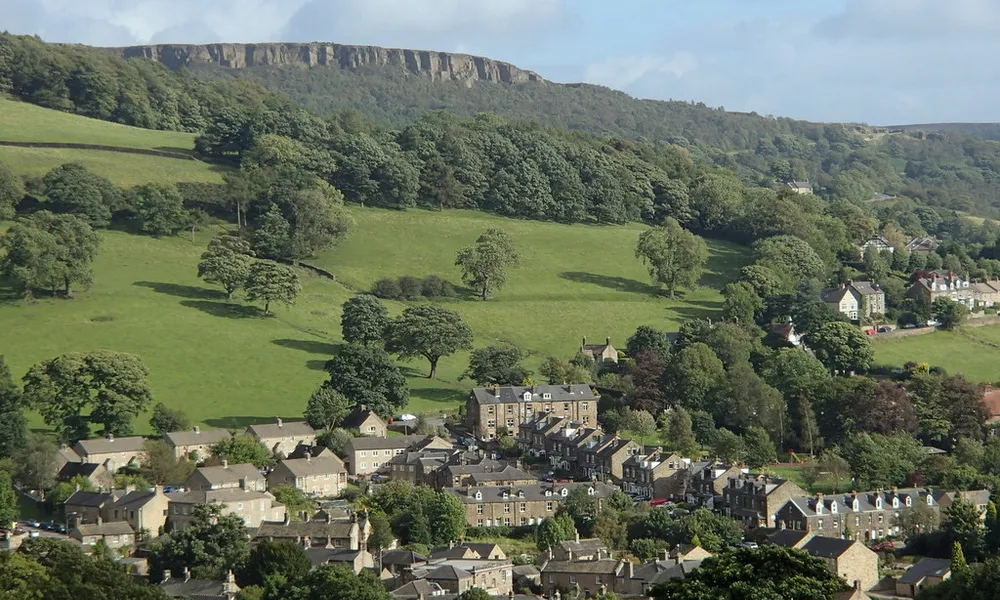 Hathersage seen from above, with the gritstone edge behind